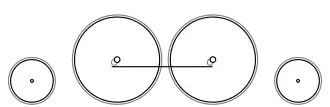 Diagram of a single small leading wheel, two large coupled wheels and a single small trailing wheel
