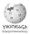 Wikipedia logo displaying the name "Wikipedia" and its slogan: "The Free Encyclopedia" below it, in Gothic