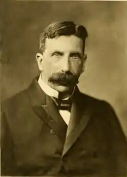Ridgeway in formal dress, with a large, bushy moustache