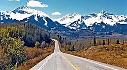 Sunshine Mountain (left) and Wilson Peak (right) from southbound Highway 145