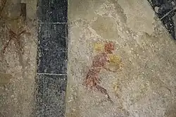 Painted depiction of two men wrestling