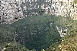 A large sinkhole in a mountain area
