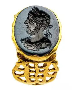 Gold Roman signet ring with portrait of emperor Commodus in niccolo agate, 180-200 CE, found in Tongeren, Gallo-Roman Museum (Tongeren)