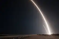 Long exposure of the launch and landing of the first stage of the Falcon 9