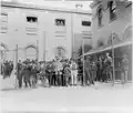 Immigrants from a smallpox ship, held in custody for observation, behind wire fence, Hoffman Island, N.Y.